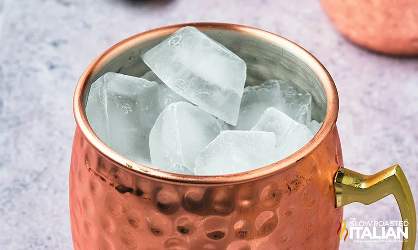 copper mug full of ice cubes