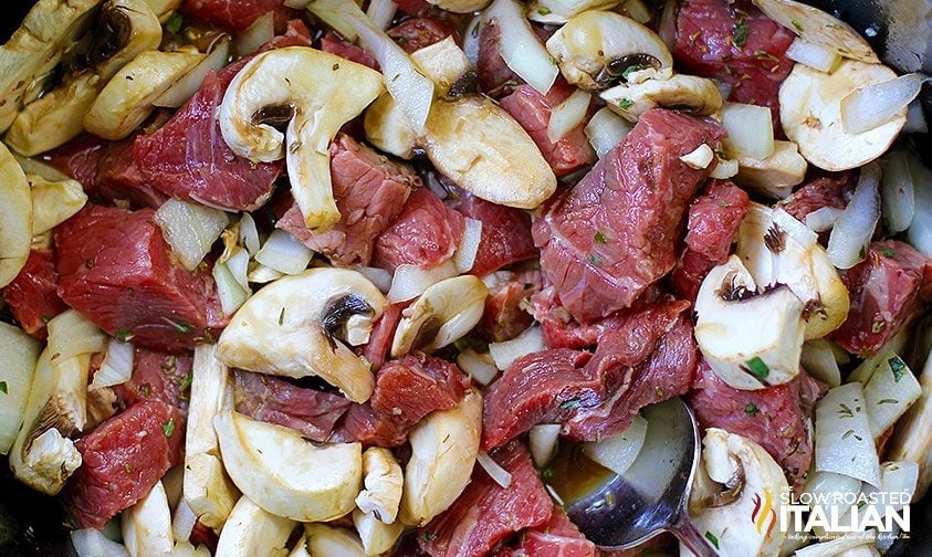 cubed chuck roast, mushrooms, and onions in slow cooker