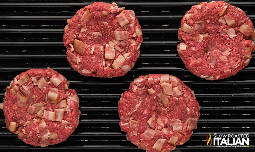 bacon in a burger patty on the grill