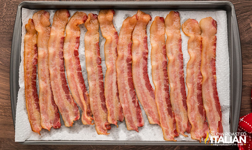 cooked bacon on a baking sheet