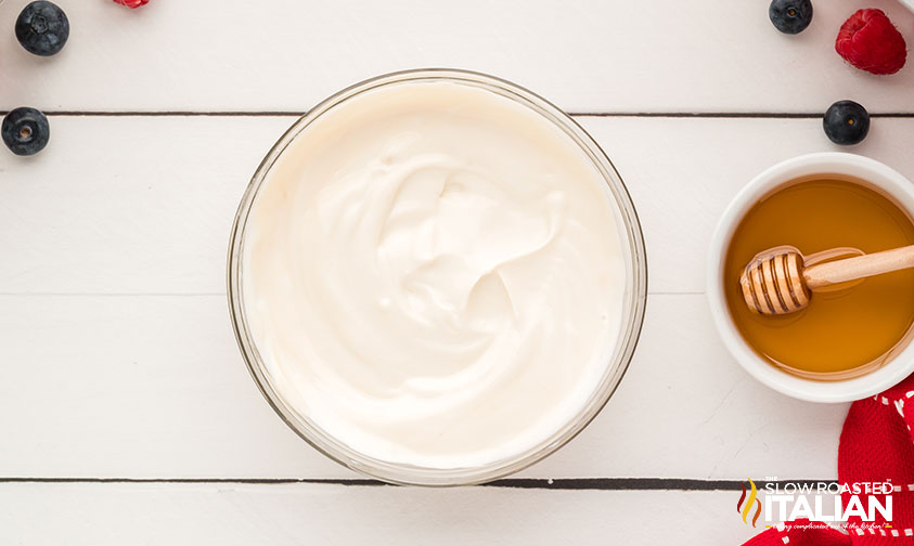 yogurt, honey, and vanilla mixed in a bowl