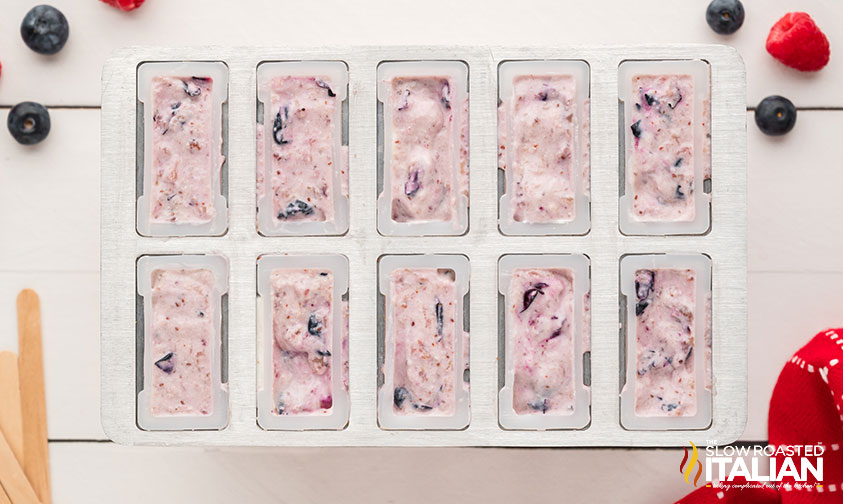 red white and blue popsicle mixture in popsicle mold