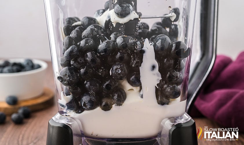 yogurt and blueberries added to blender