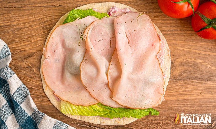 cream cheese spread, lettuce and turkey added to flour tortillas