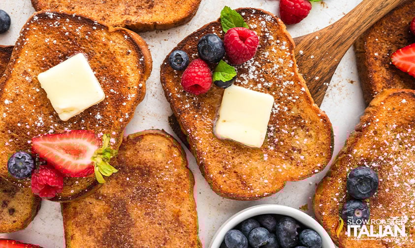 top view of sheet pan french toast with butter and fruit