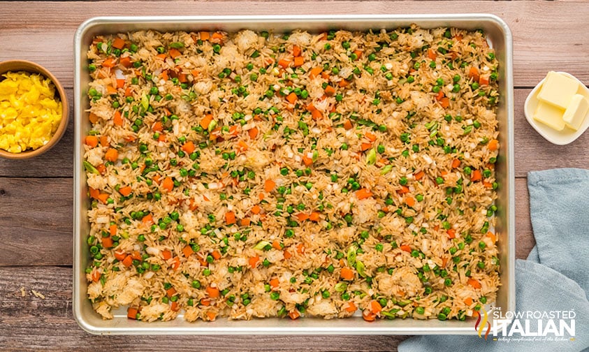 rice mixture added to a large sheet pan