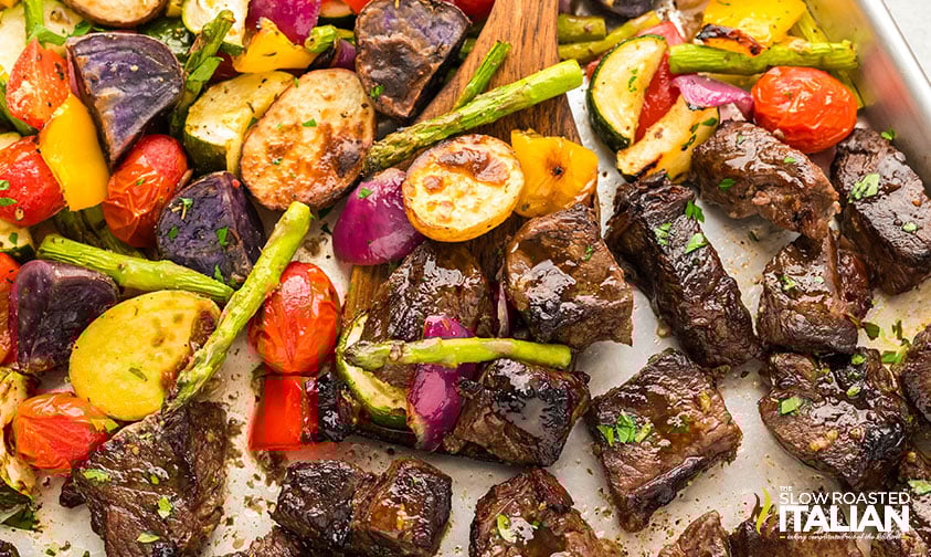 oven baked steak bites and vegetables on a sheet pan