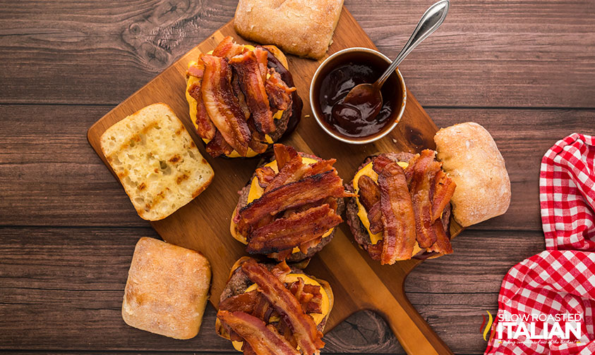 building barbecue bacon burgers on a cutting board