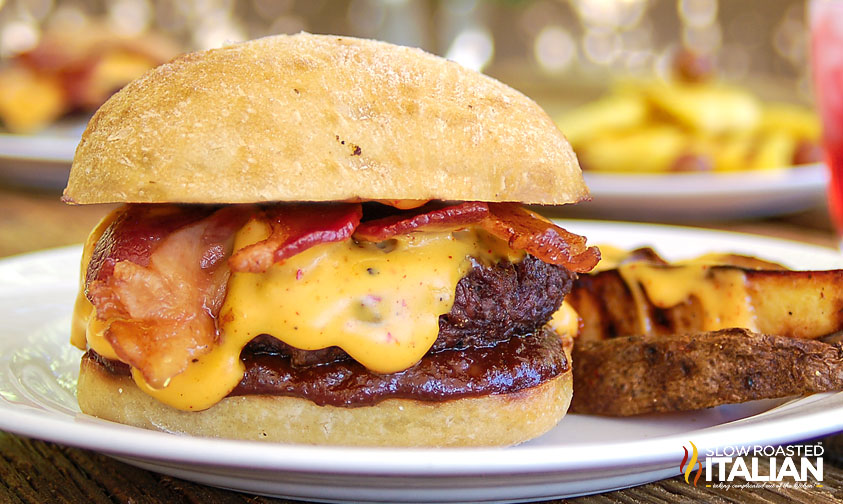 closeup of a barbecue bacon burger on a plate