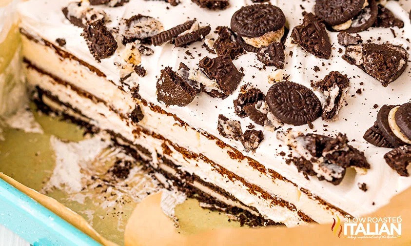 layered ice cream cake with ice cream sandwiches and oreos and cool whip