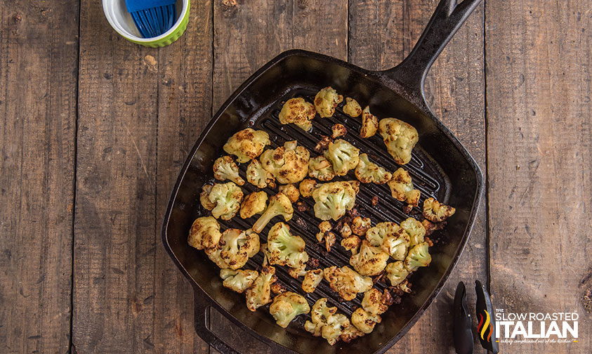 overhead: cooked cauliflower in a cast iron grill pan for cilantro cauliflower rice