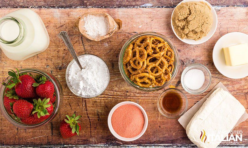 overhead: ingredients for strawberry pretzel salad in a bowl on counter