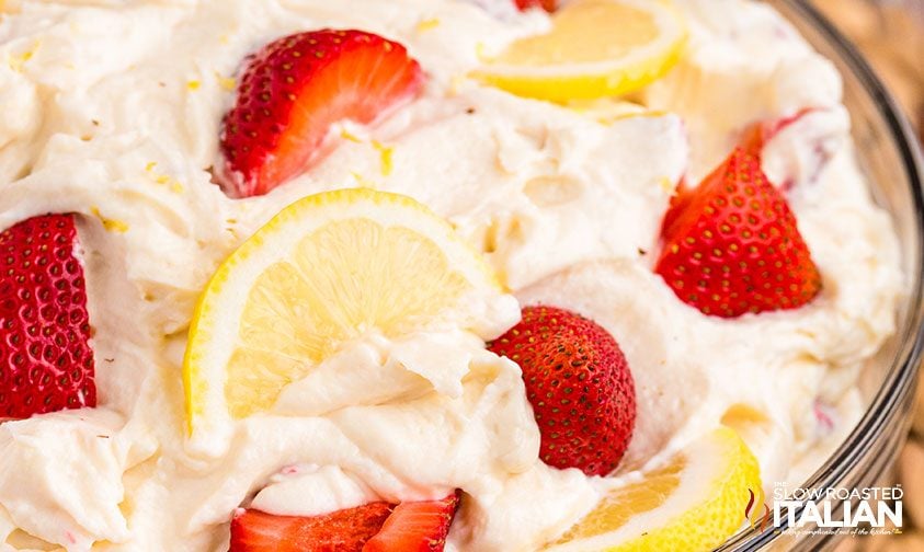 close up: strawberry lemonade cheesecake salad with fresh berries and lemons