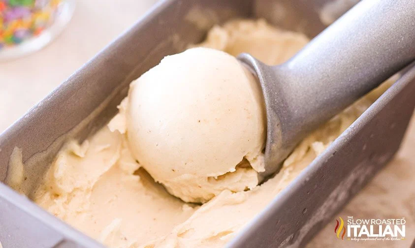 scooping banana nice cream from metal container