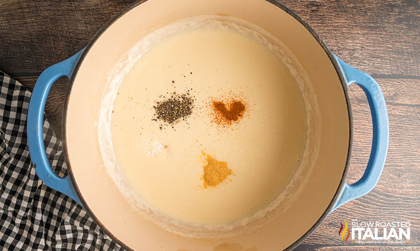 adding half & half and seasonings to roux in dutch oven