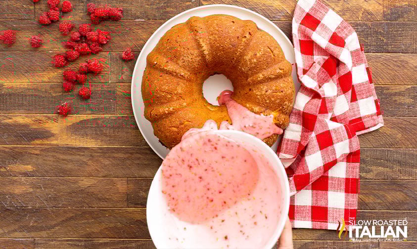 overhead: drizzling glaze over lemon and raspberry pound cake