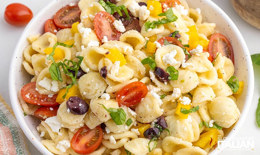 orecchiette pasta salad in a small white bowl