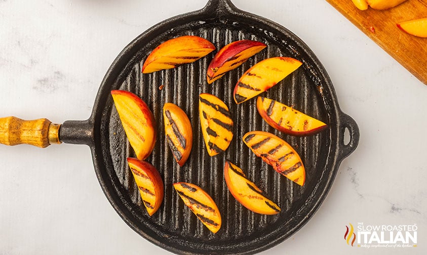 grilled peaches in a cast iron grill pan