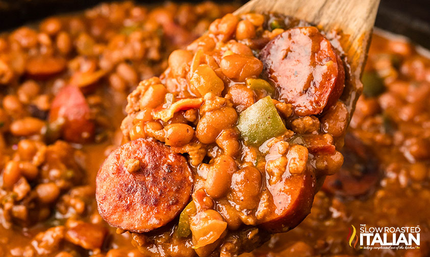 closeup of cowboy beans on a wooden spoon