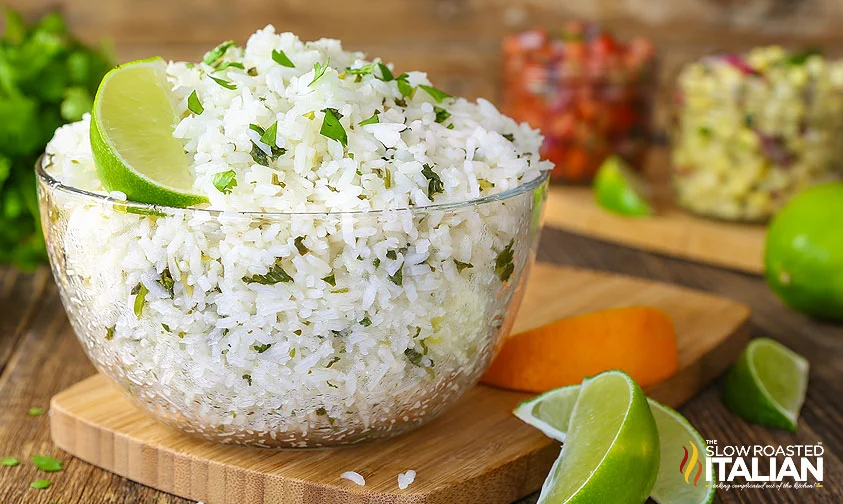 clear bowl of chipotle cilantro lime rice topped with lime wedge
