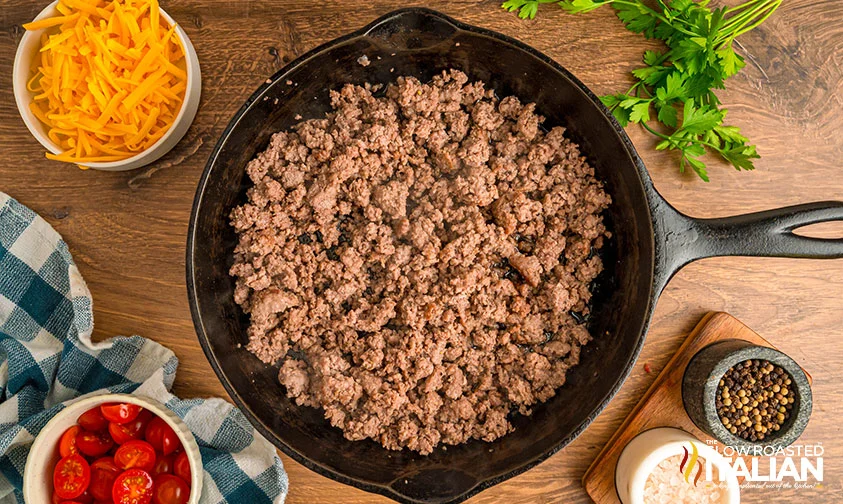 cooked ground beef in cast iron skillet