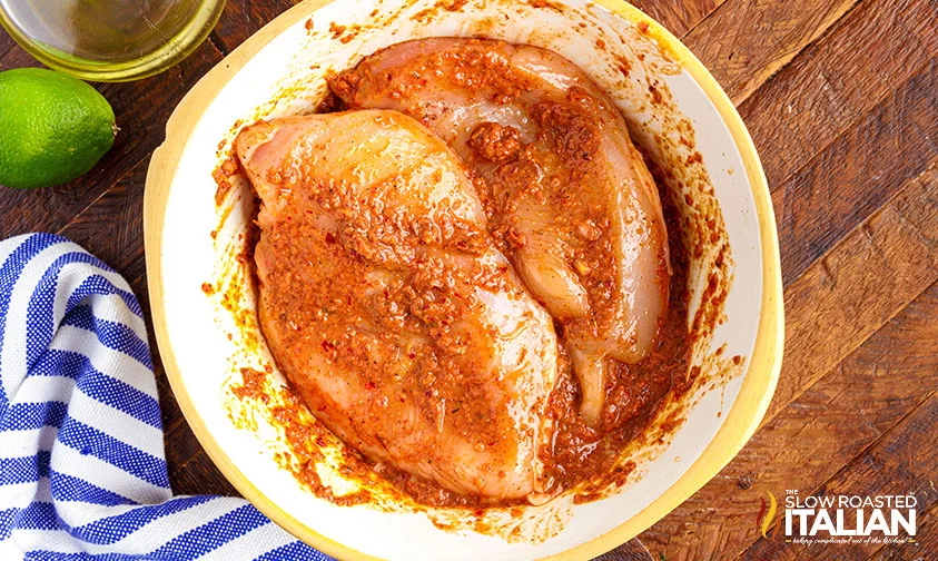 boneless chicken breasts marinating in chipotle sauce