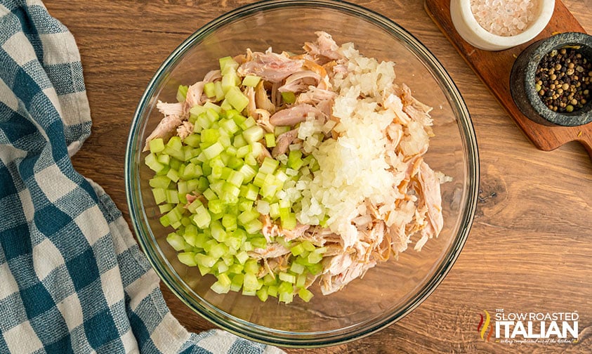 shredded chicken and chopped celery and onion in a large mixing bowl