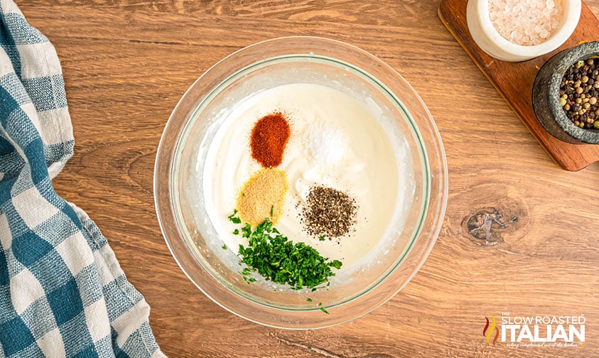 mayonnaise, sour cream, lemon juice and seasoning in a small bowl
