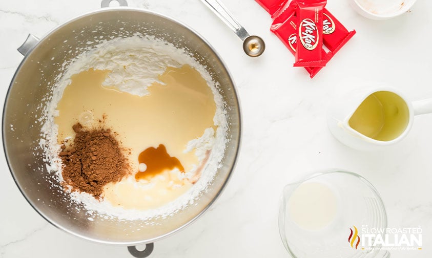 whipped cream, cocoa powder, sweetened condensed milk and vanilla extract in mixing bowl