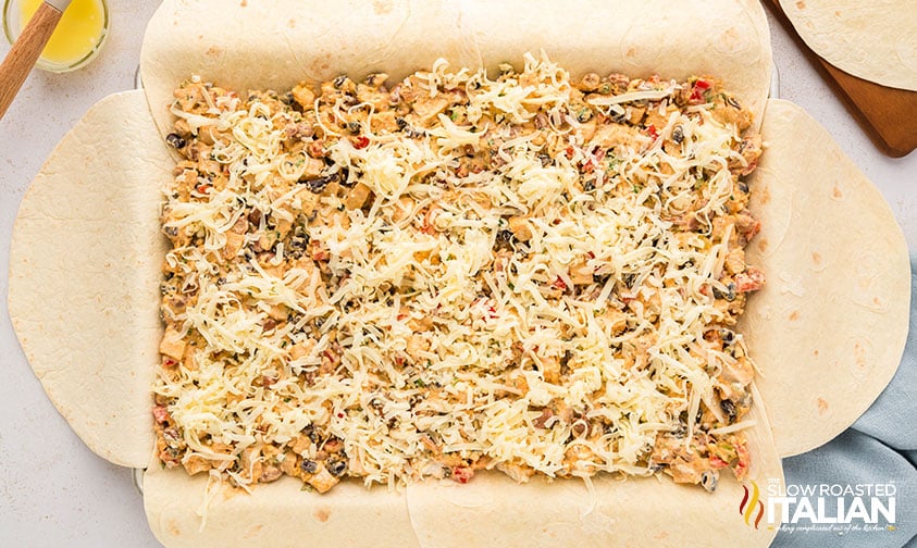 tortillas fill quesadilla ingredients on a sheet pan