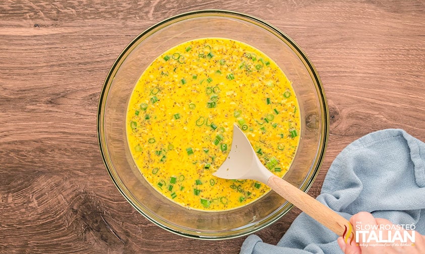 whisked frittata egg mixture in a large mixing bowl