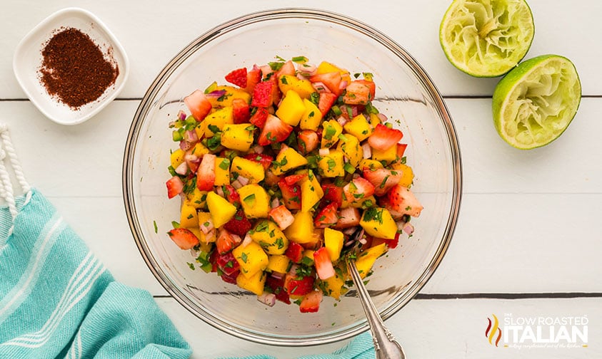 mixed strawberry mango salsa ingredients in a large bowl