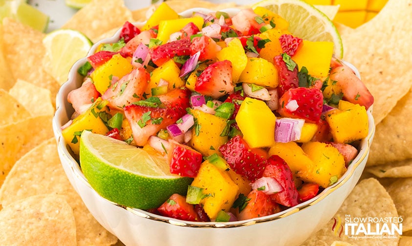 bowl of strawberry mango salsa surrounded with tortilla chips
