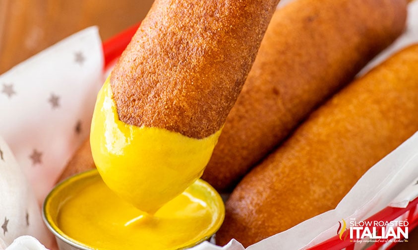 dipping Disneyland corn dog in mustard