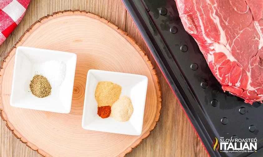 spices in pinch bowls next to tray of beef