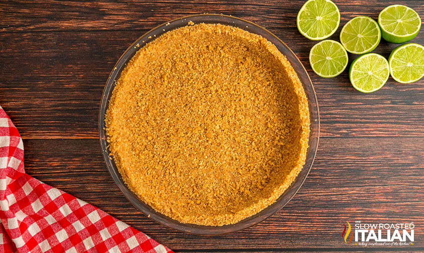 key lime pie crust in a pie plate