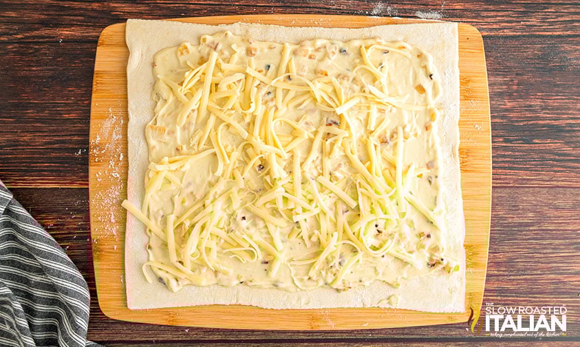 filling and cheese in puff pastry dough
