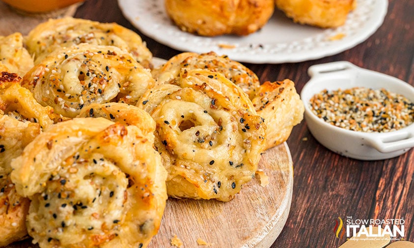 wooden tray of costco onion and cheese pinwheels