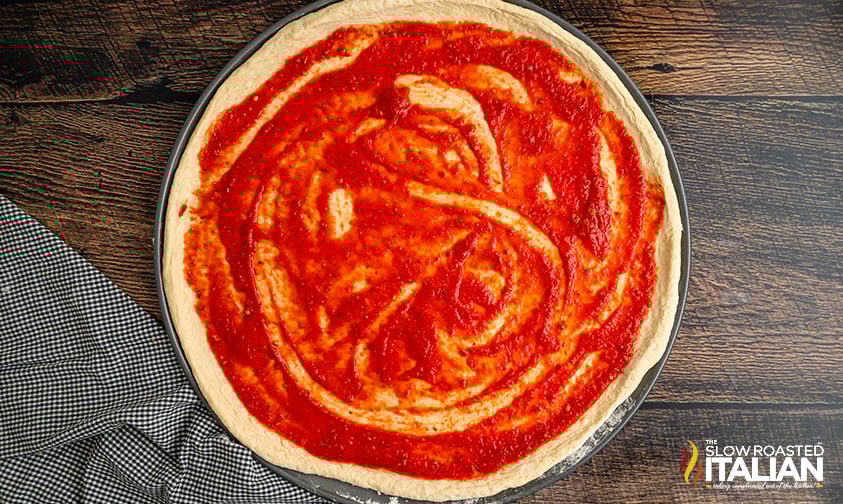 sauce added to pizza dough