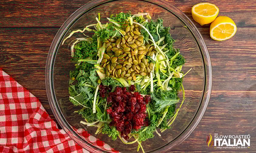 ingredient for sweet kale salad in a large mixing bowl