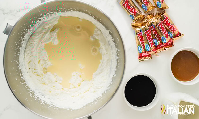 whipped cream and sweetened condensed milk in large mixing bowl
