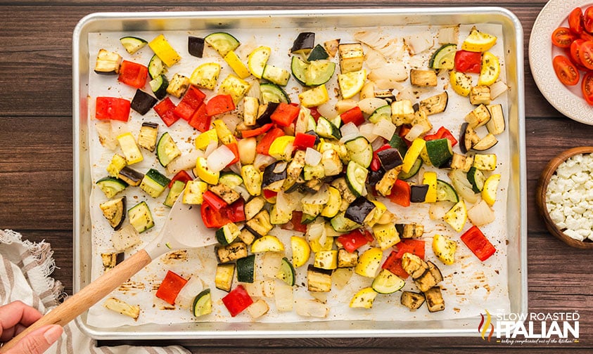 adding seasoning and mixing vegetables