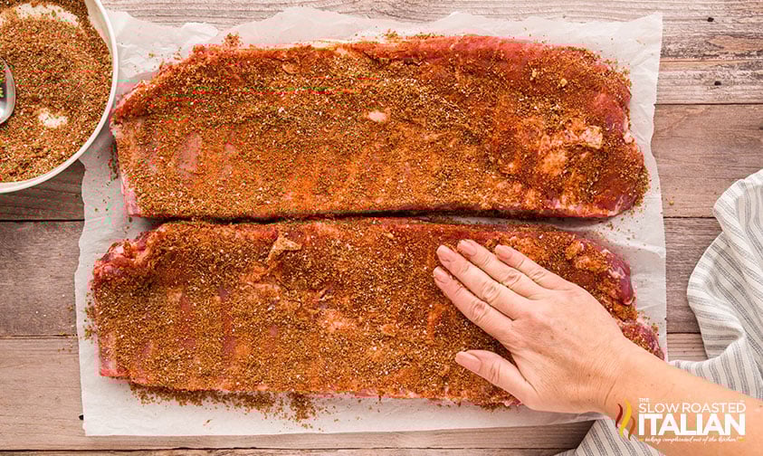 adding dry rub to sheet pan ribs