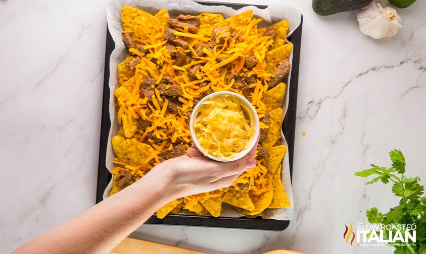 assembling sheet pan steak nachos