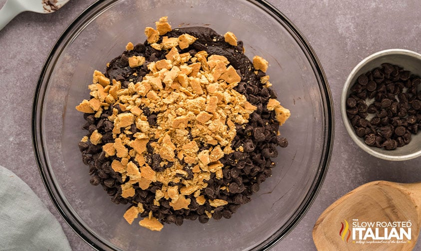 adding graham cracker crumbs to cookie dough