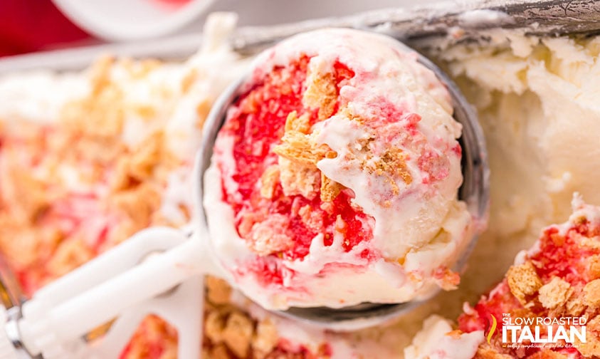 scoop of strawberry cheesecake ice cream in an ice cream scoop
