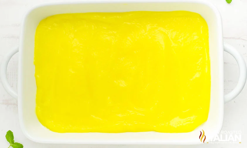 lemon pie filling spread into the bottom of a baking dish
