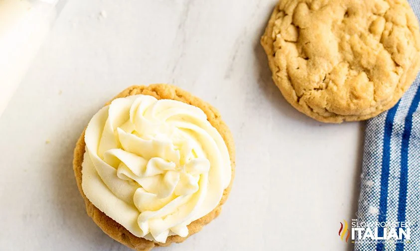 frosting piped onto a peanut butter cookie