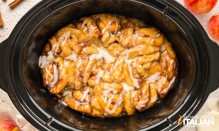 icing drizzled on crockpot cinnamon rolls