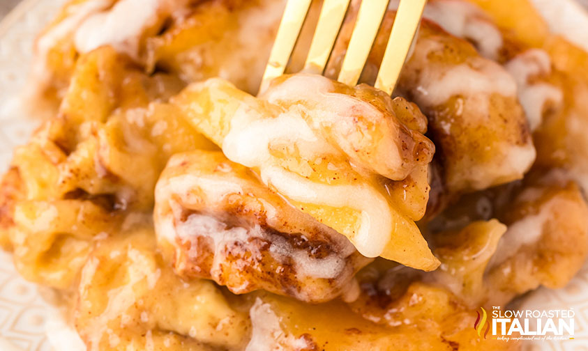 closeup of crockpot cinnamon rolls on a fork
